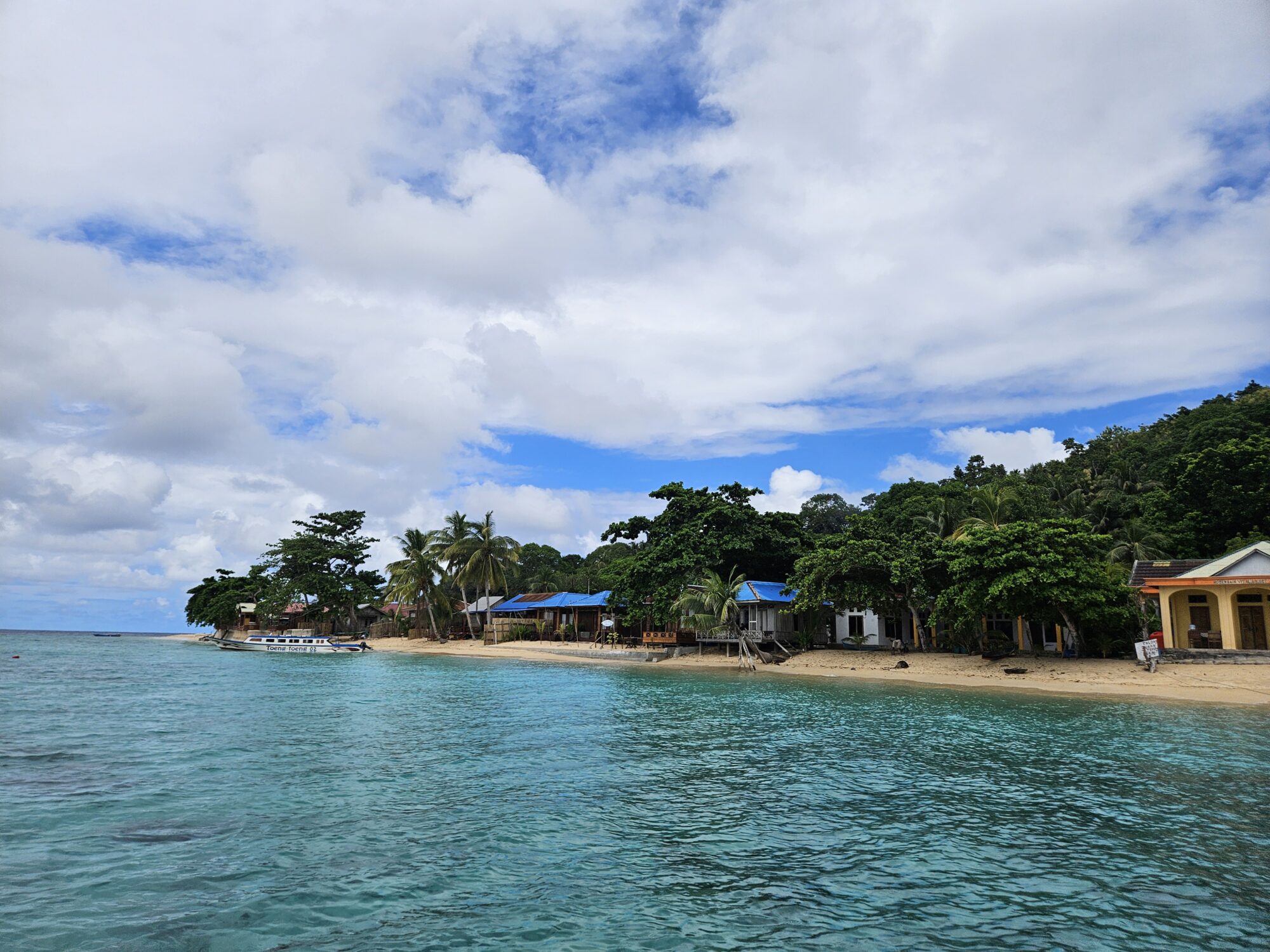 The view of the beach when you arrive by boat at Hatta Island, part of the Banda Islands in Indonesia