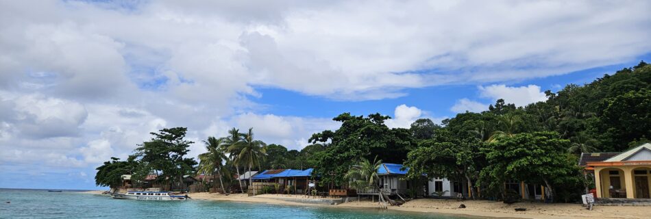 The view of the beach when you arrive by boat at Hatta Island, part of the Banda Islands in Indonesia