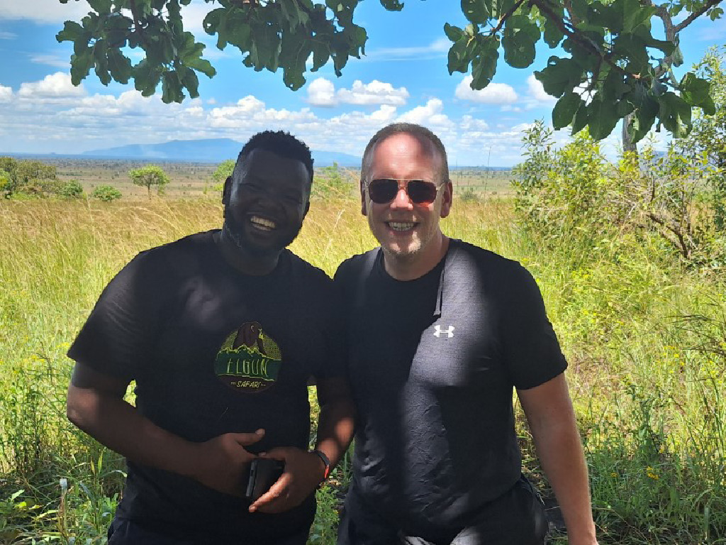 Jan Boelo posing with Fred Masaba from Elgon Safaris Uganda at Pian Upe Wildlife Reserve in Uganda