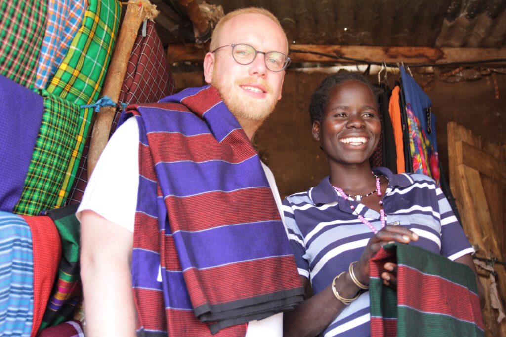 Jan Boelo visiting a local market in Karamoja Uganda to buy Shuka