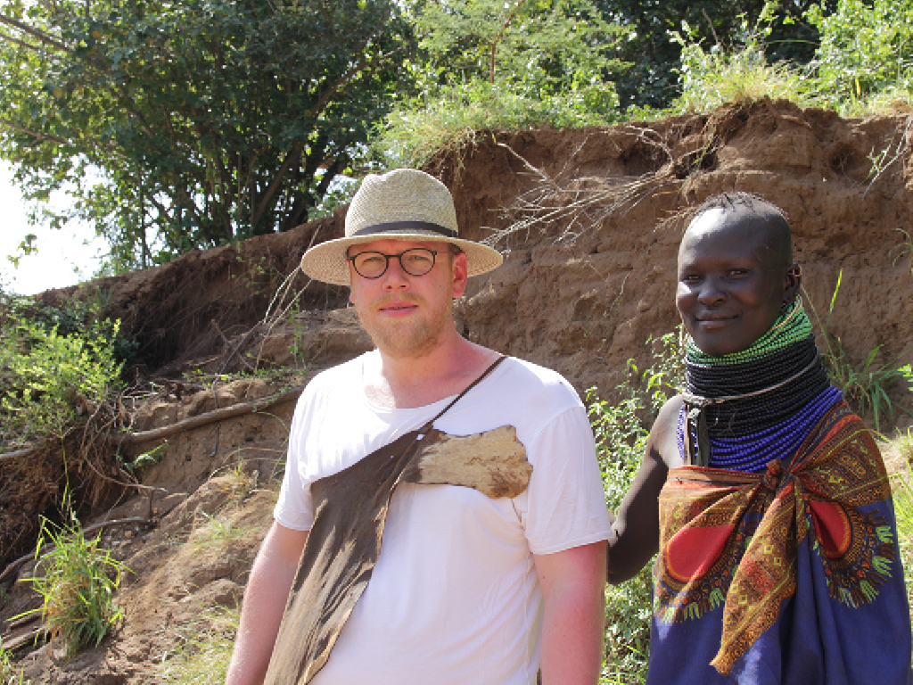 Jan Boelo trying on a piece of goat leather in Karamoja