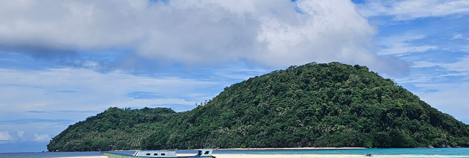 The view of the beach when you go by boat to Ay Island, part of the Banda Islands in Indonesia