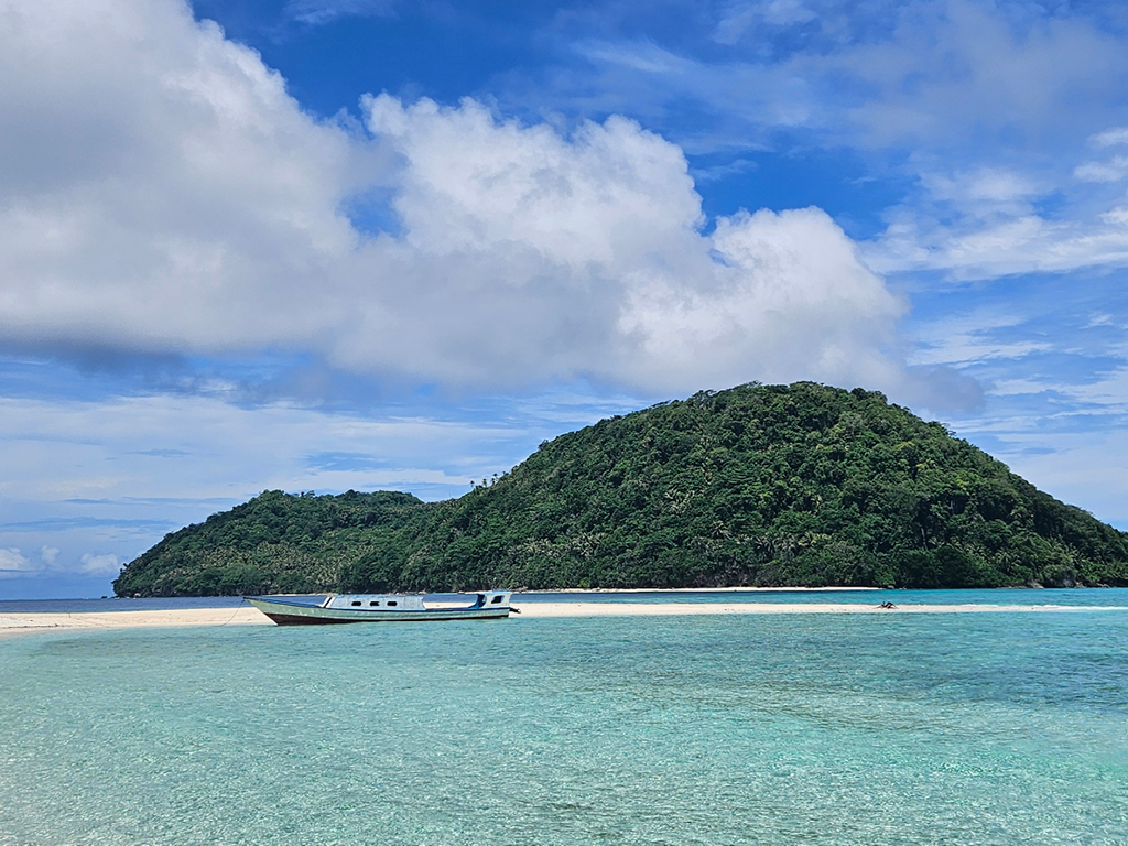 The view of the beach when you go by boat to Ay Island, part of the Banda Islands in Indonesia